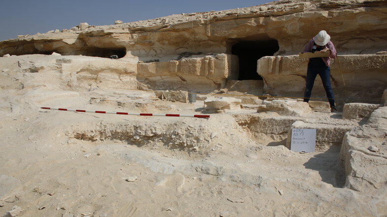 The egyptologist Delphine Driaux documenting archaeological structures.