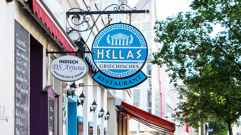 Shop sign Hellas Restaurant, blue and white stripes