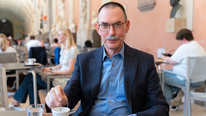 Portrait of Martin Kusch in a café