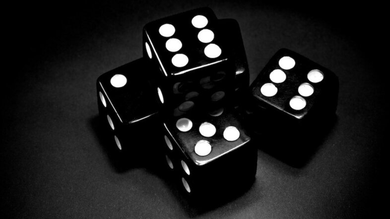 4 Black dice on a black background