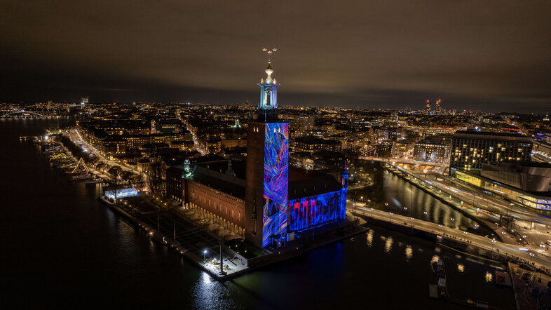 Illuminated City Hall in Stockholm during the Nobel Week Lights Festival