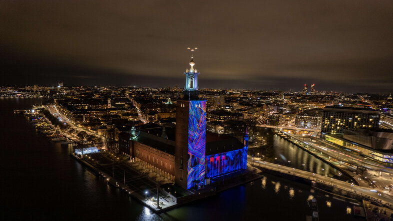 Illuminated City Hall in Stockholm during the Nobel Week Lights Festival